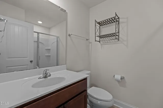 a bathroom with a sink double vanity granite tub shower and a mirror