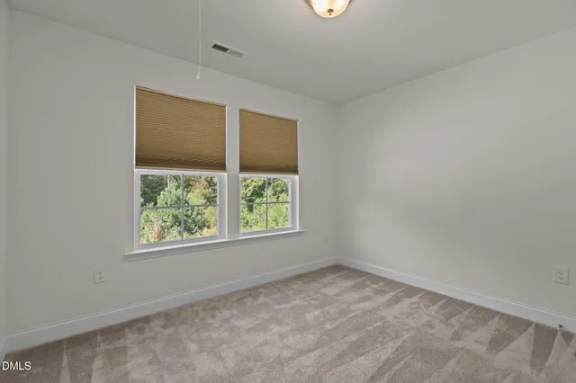 a view of a house with a yard and garage