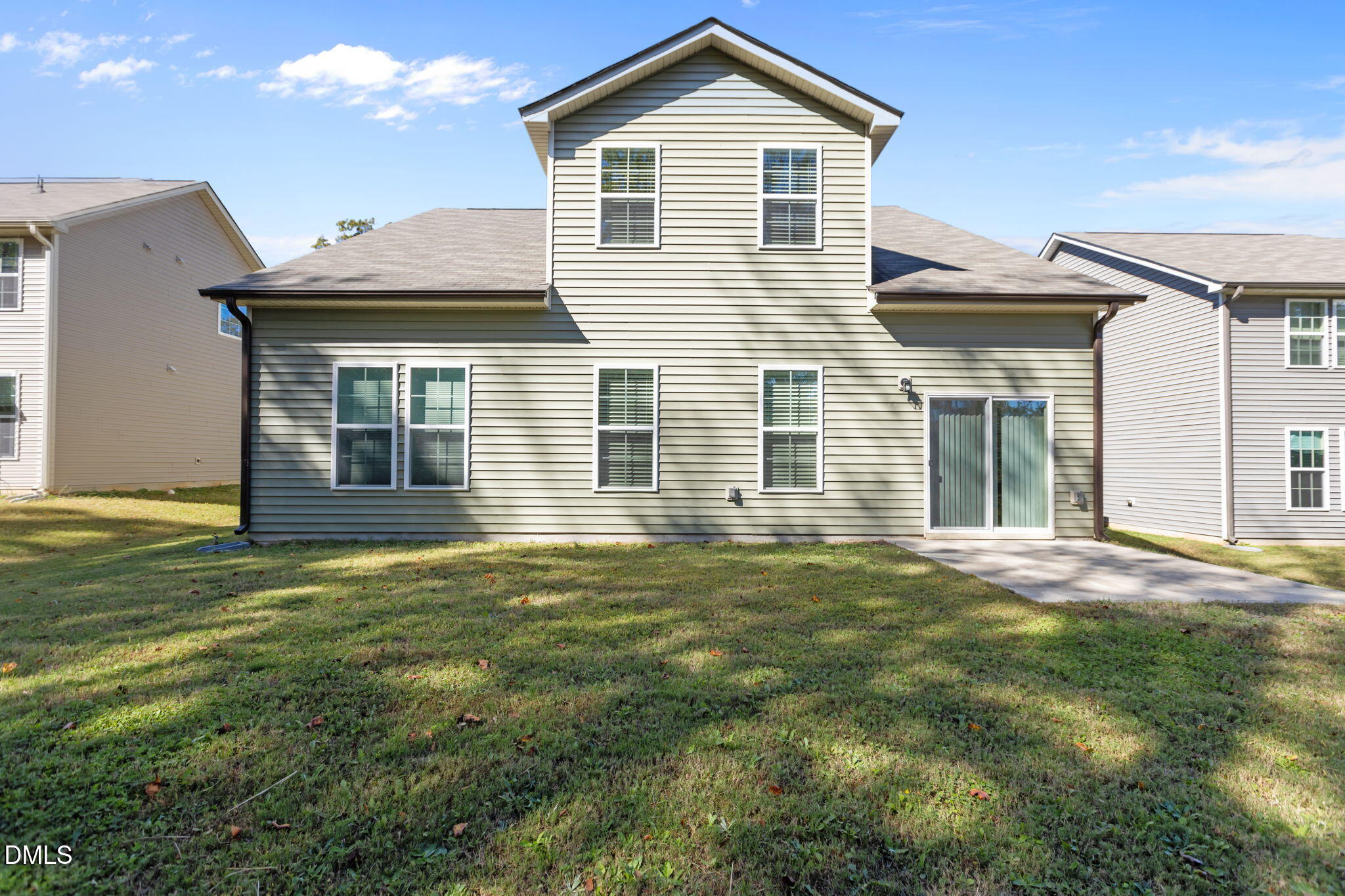 354 Dando Street Garner, NC 27529 - Photo 39 of 61 a front view of a house with a garden