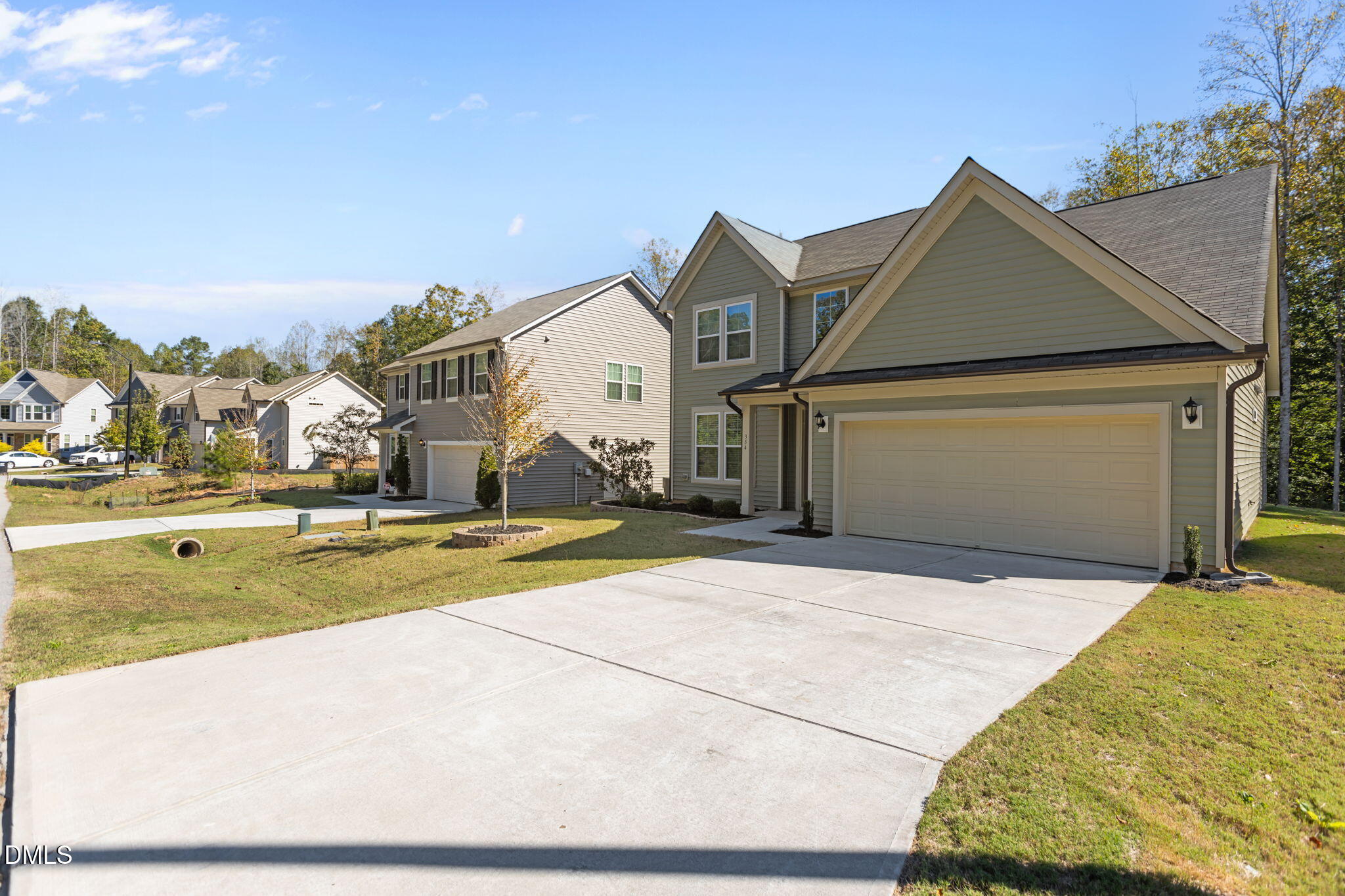 354 Dando Street Garner, NC 27529 - Photo 4 of 61 a view of a house with a yard and sitting area