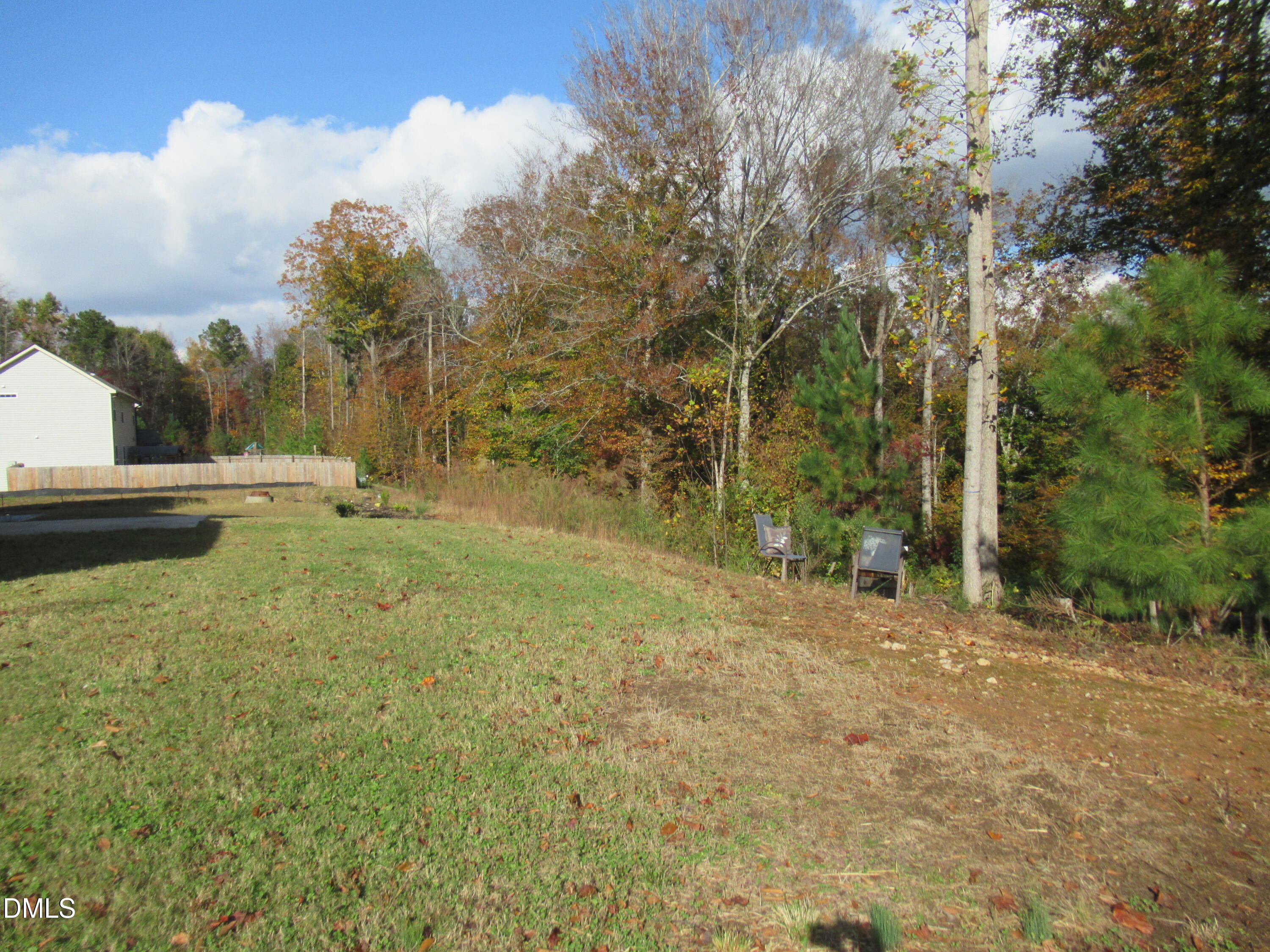 354 Dando Street Garner, NC 27529 - Photo 46 of 61 a view of dirt yard with large trees