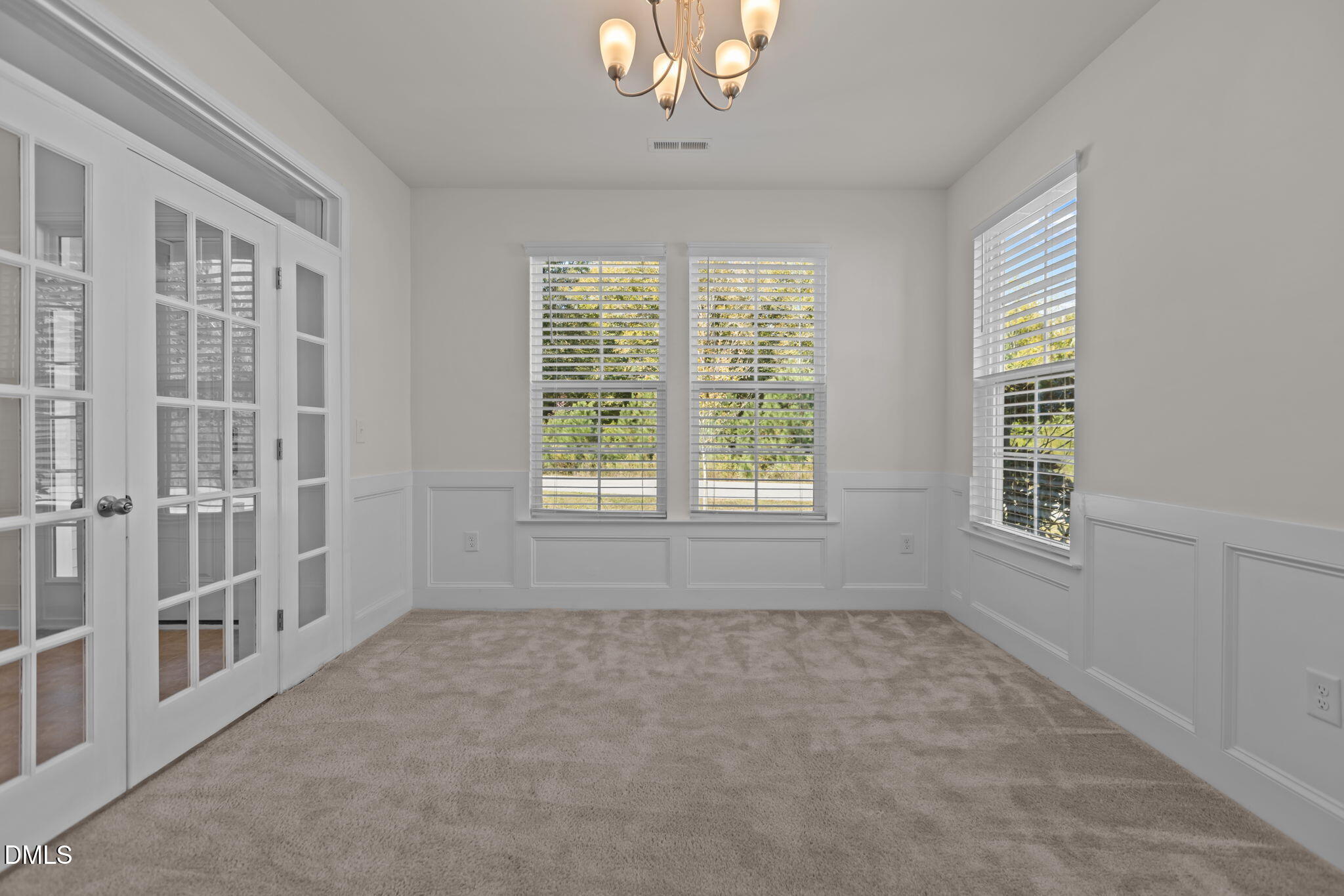 354 Dando Street Garner, NC 27529 - Photo 8 of 61 a view of an empty room with a window