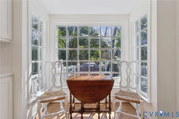 a view of a room with a table and chairs