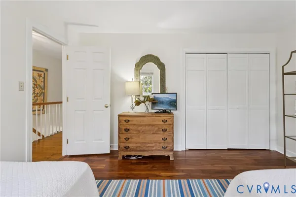 a view of living room with furniture and wooden floor