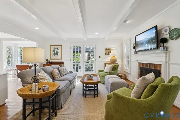 a living room with furniture fireplace and a flat screen tv
