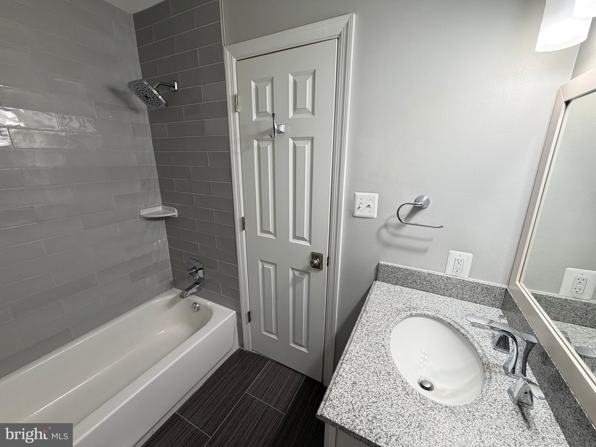 12629 English Orchard Court Silver Spring, MD 20906 - Photo 19 of 31 a bathroom with a granite countertop sink and a mirror