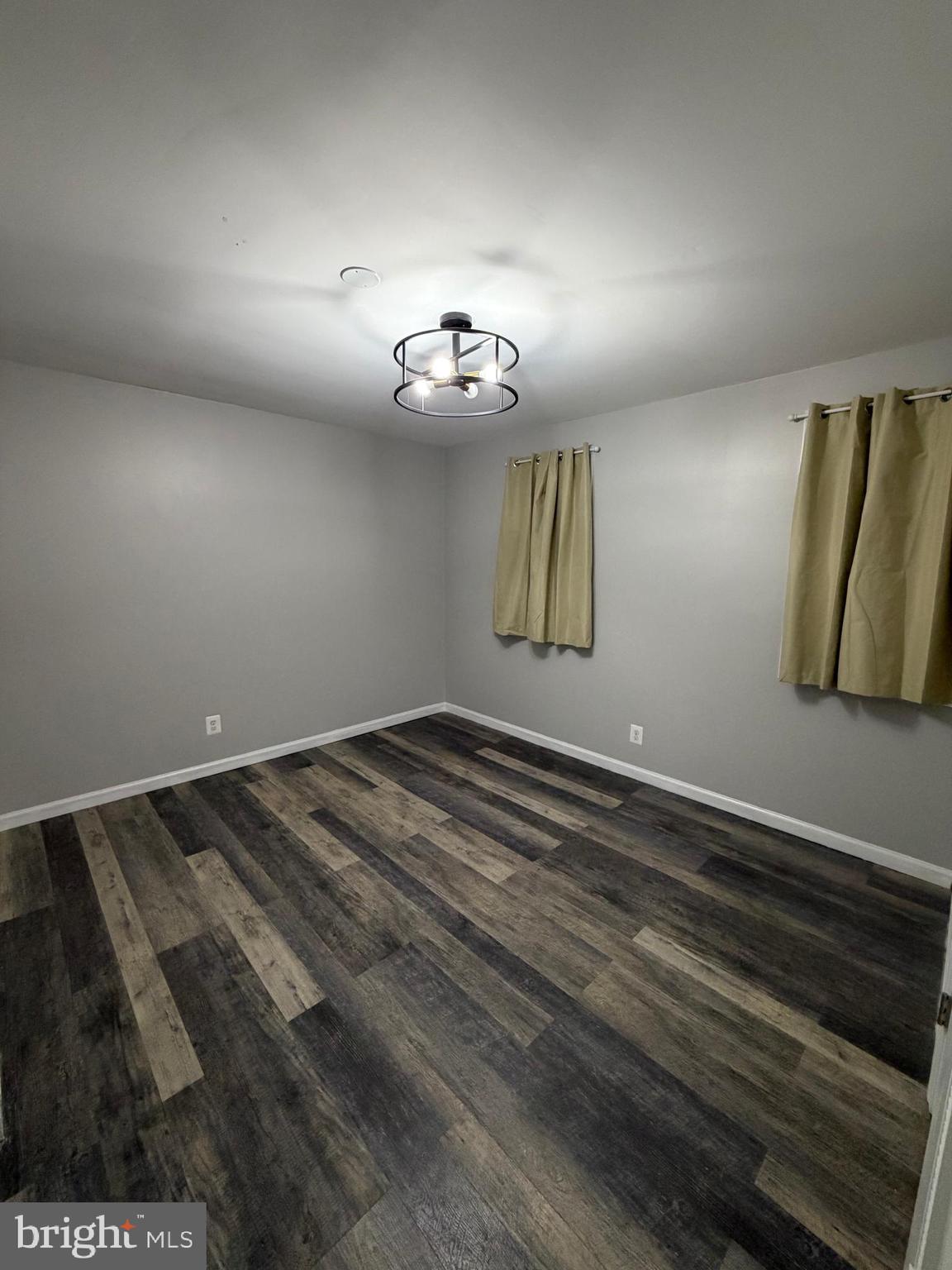 12629 English Orchard Court Silver Spring, MD 20906 - Photo 20 of 31 a view of a room with wooden floor and ceiling fan