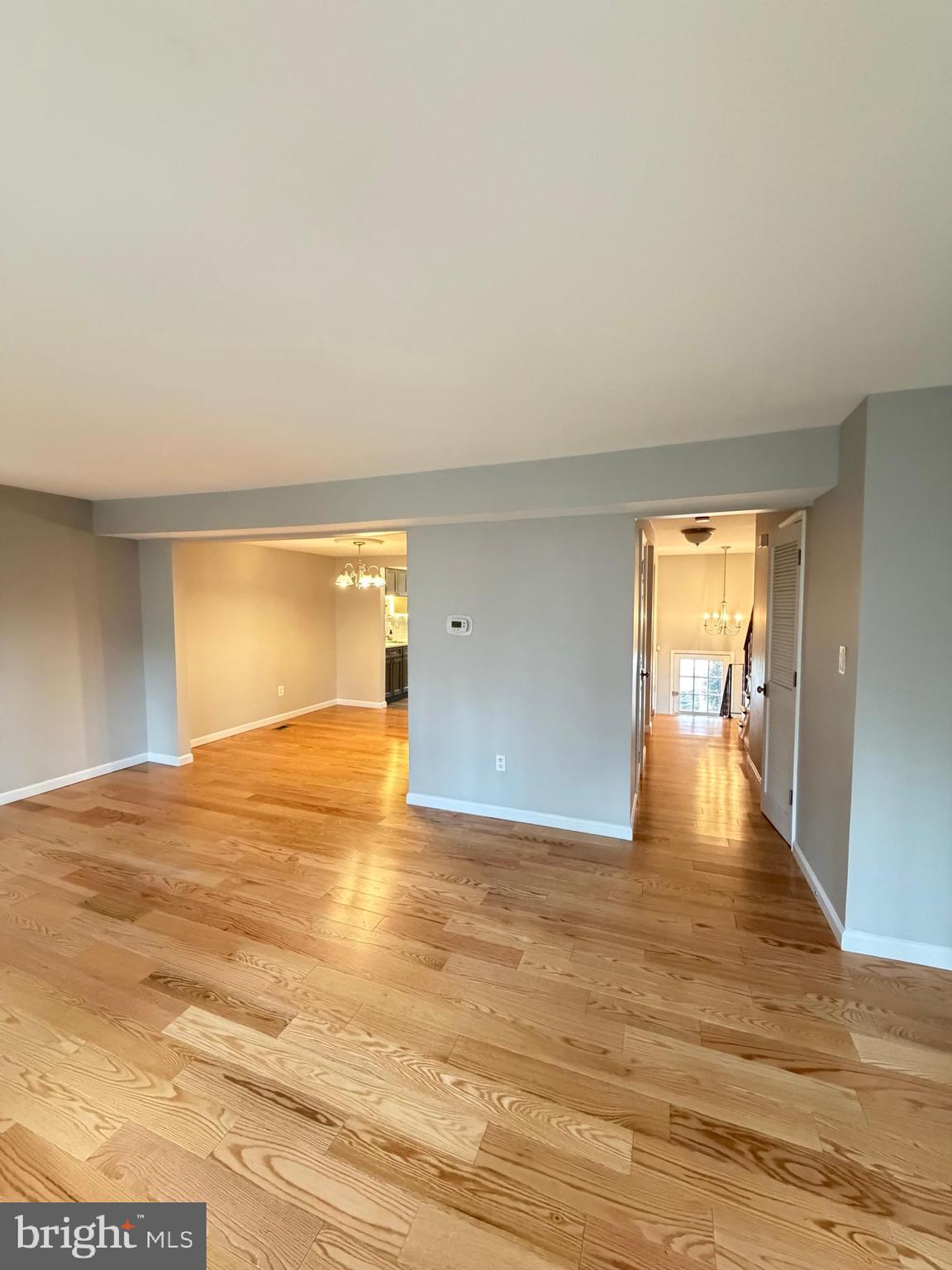 12629 English Orchard Court Silver Spring, MD 20906 - Photo 6 of 31 a view of an empty room with wooden floor and a window
