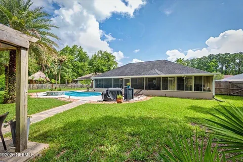 a view of a backyard with sitting area