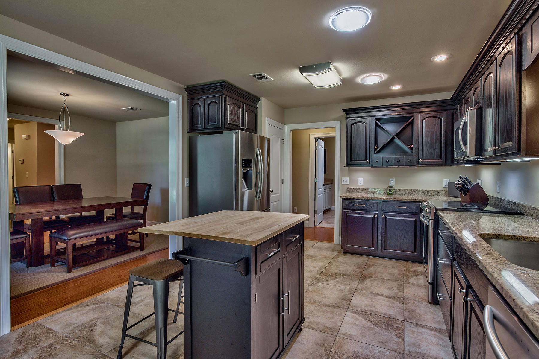 2884 Silverhill Road Crestview, FL 32536 - Photo 6 of 16 a kitchen that has a lot of cabinets in it and stainless steel appliances