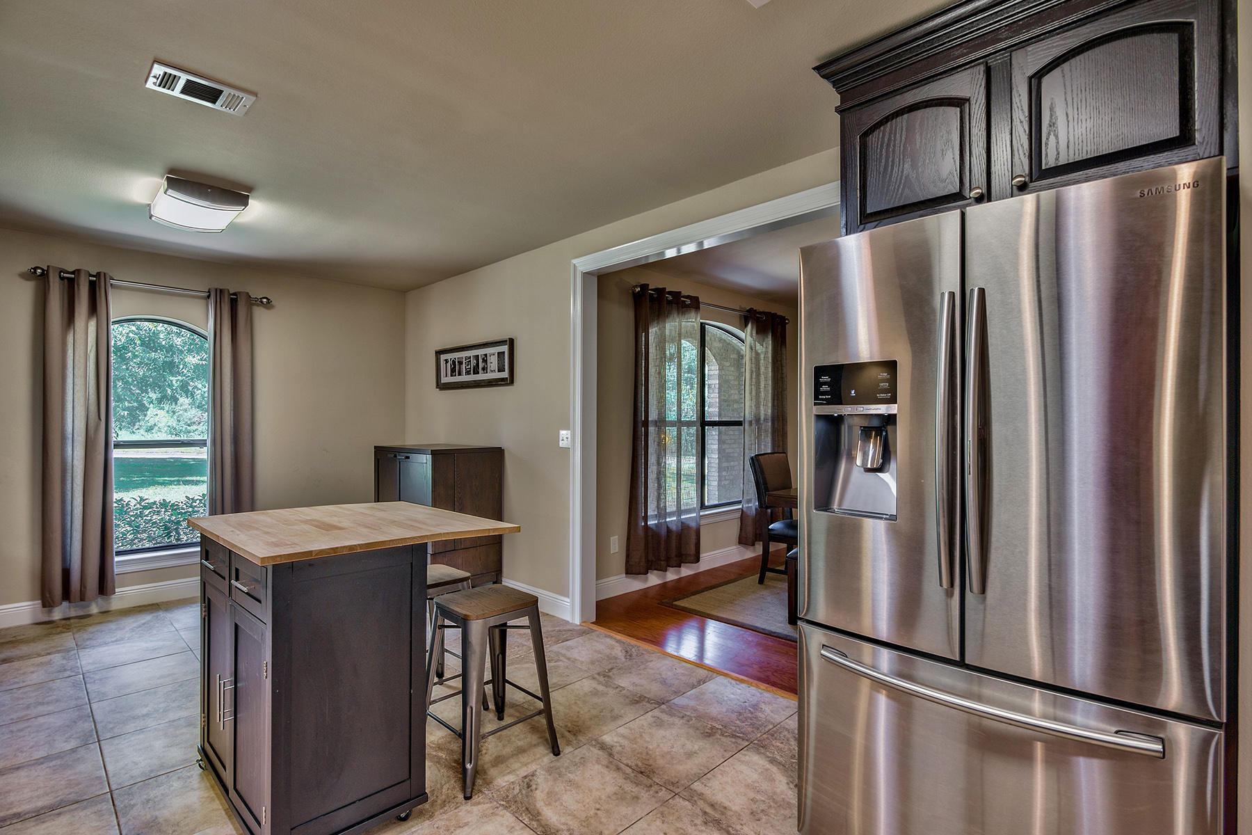 2884 Silverhill Road Crestview, FL 32536 - Photo 7 of 16 a kitchen with stainless steel appliances granite countertop a refrigerator and a stove