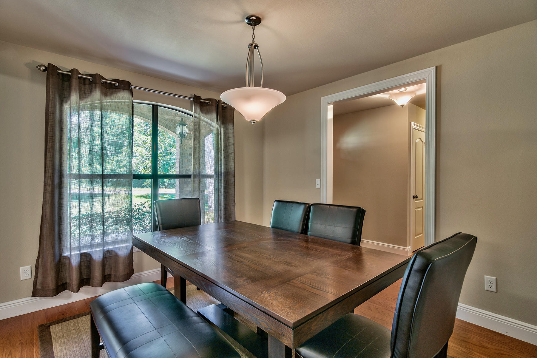 2884 Silverhill Road Crestview, FL 32536 - Photo 9 of 16 a view of a dining room with furniture window and wooden floor