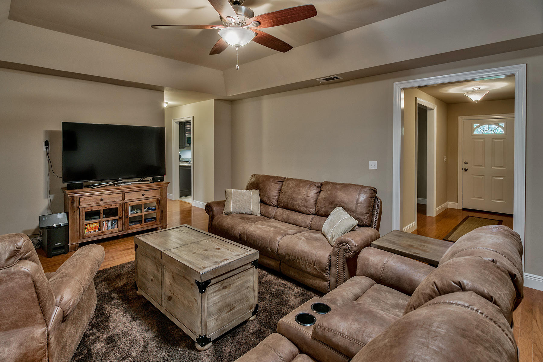 2884 Silverhill Road Crestview, FL 32536 - Photo 10 of 16 a living room with furniture and a flat screen tv