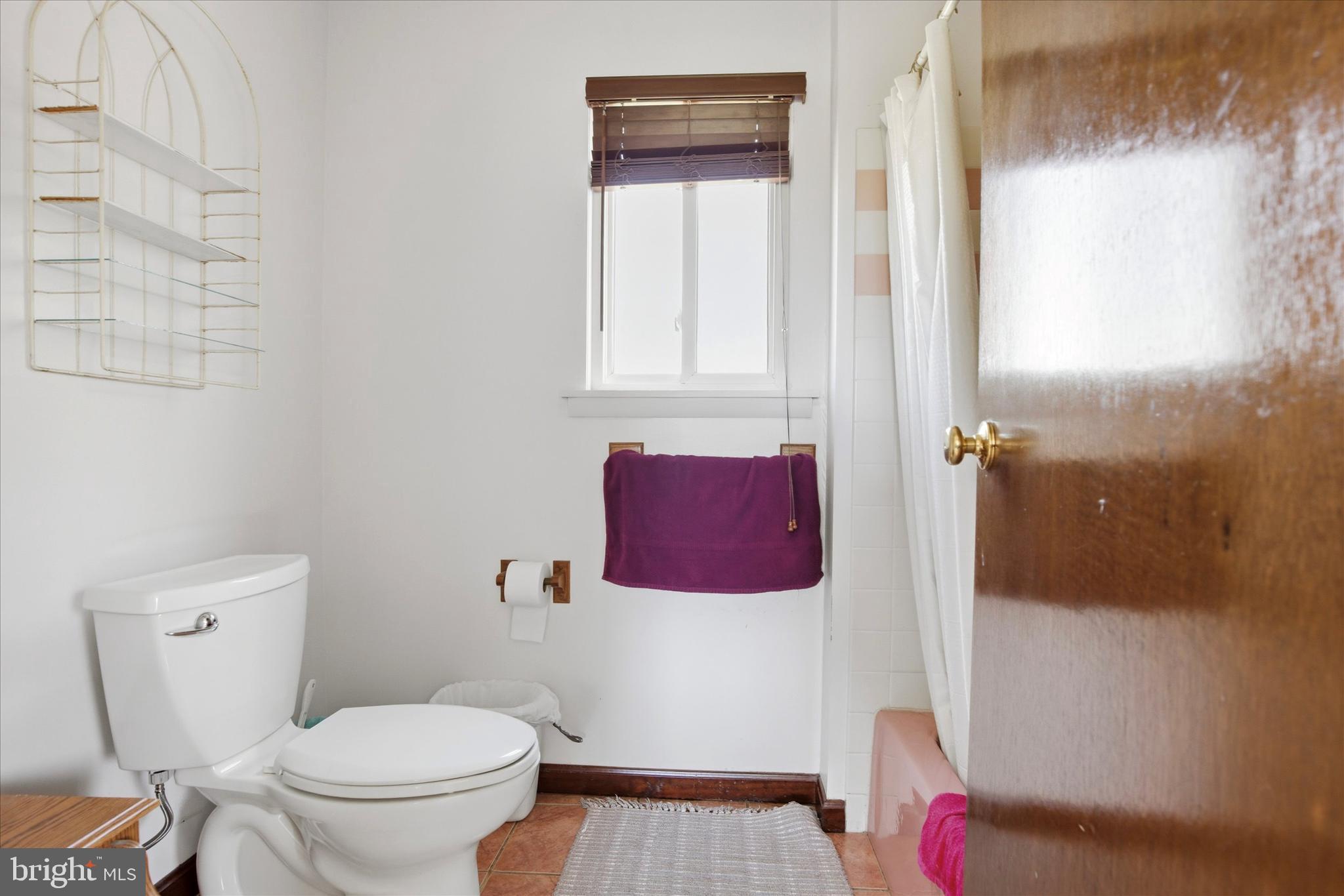 1265 Old York Road Warminster, PA 18974 - Photo 19 of 35 a bathroom with a toilet and a shower curtain