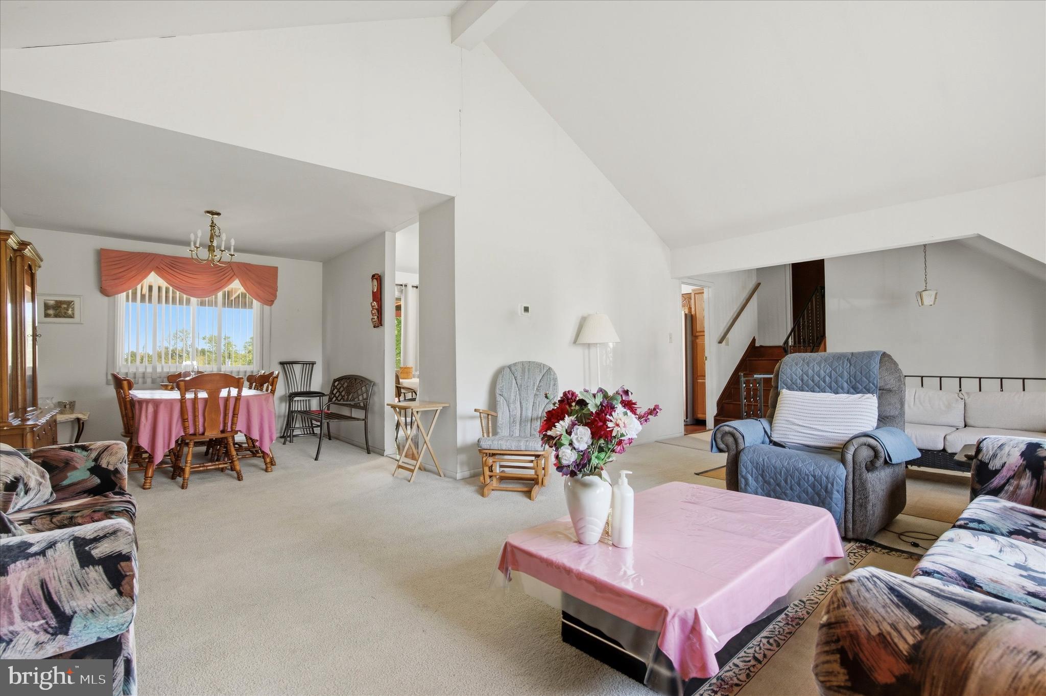1265 Old York Road Warminster, PA 18974 - Photo 4 of 35 a living room with furniture a chandelier and a flat screen tv