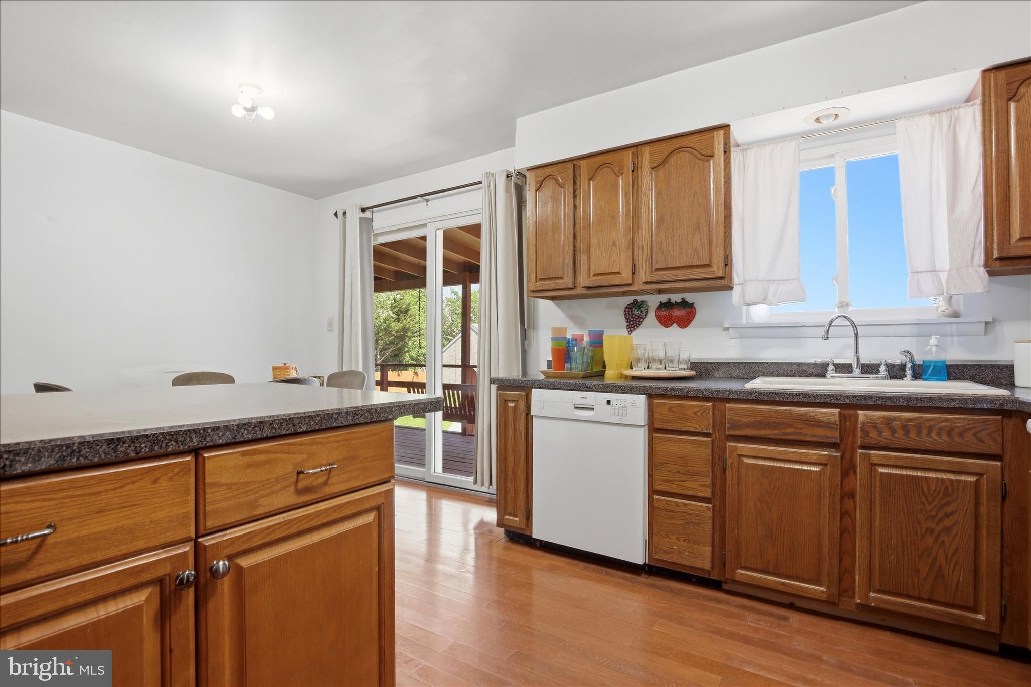 1265 Old York Road Warminster, PA 18974 - Photo 7 of 35 a kitchen with granite countertop cabinets stainless steel appliances a sink and a window