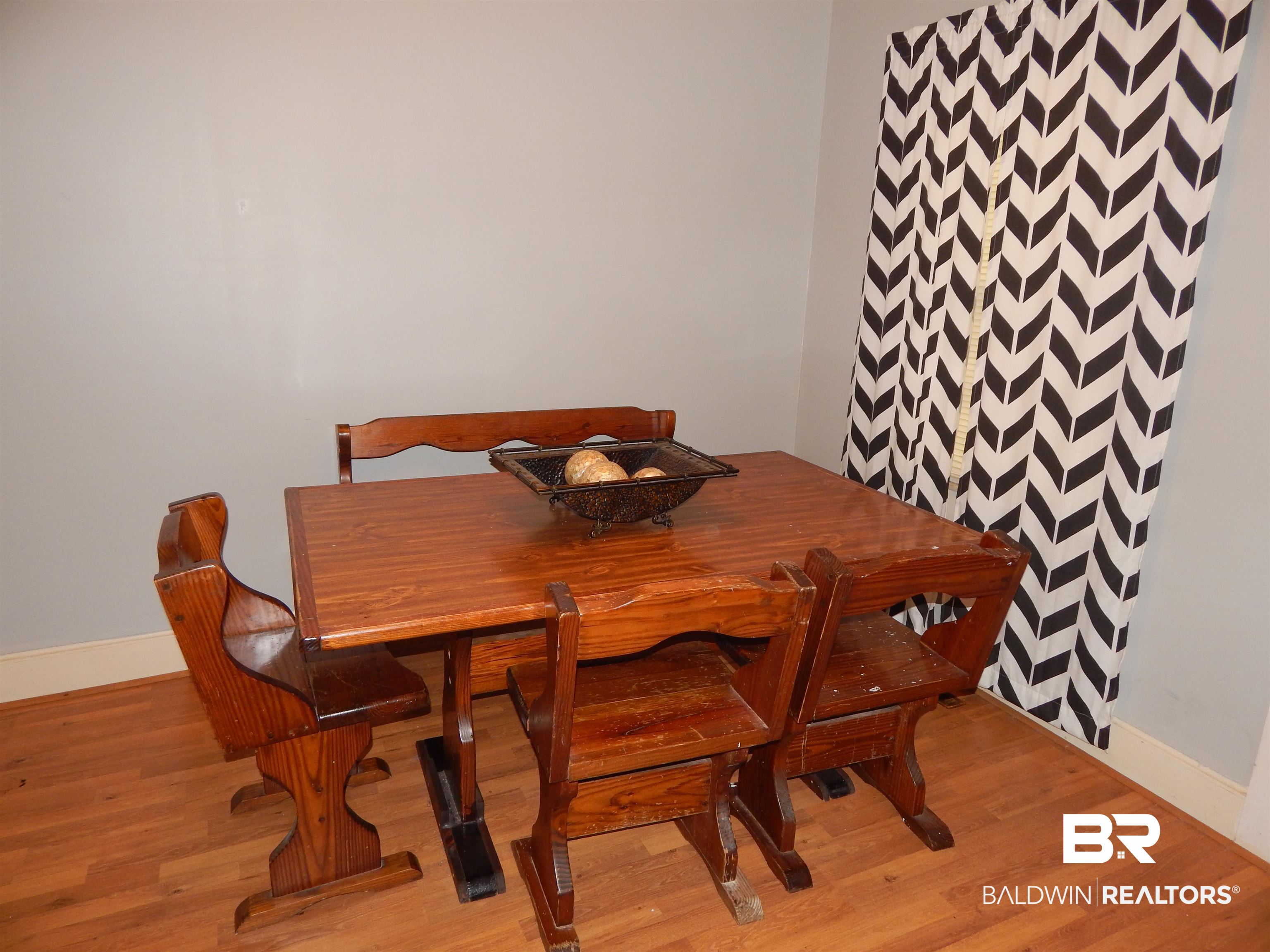 309 Bellview Avenue Evergreen, AL 36401 - Photo 13 of 27 Dining room featuring baseboards and light wood-style flooring