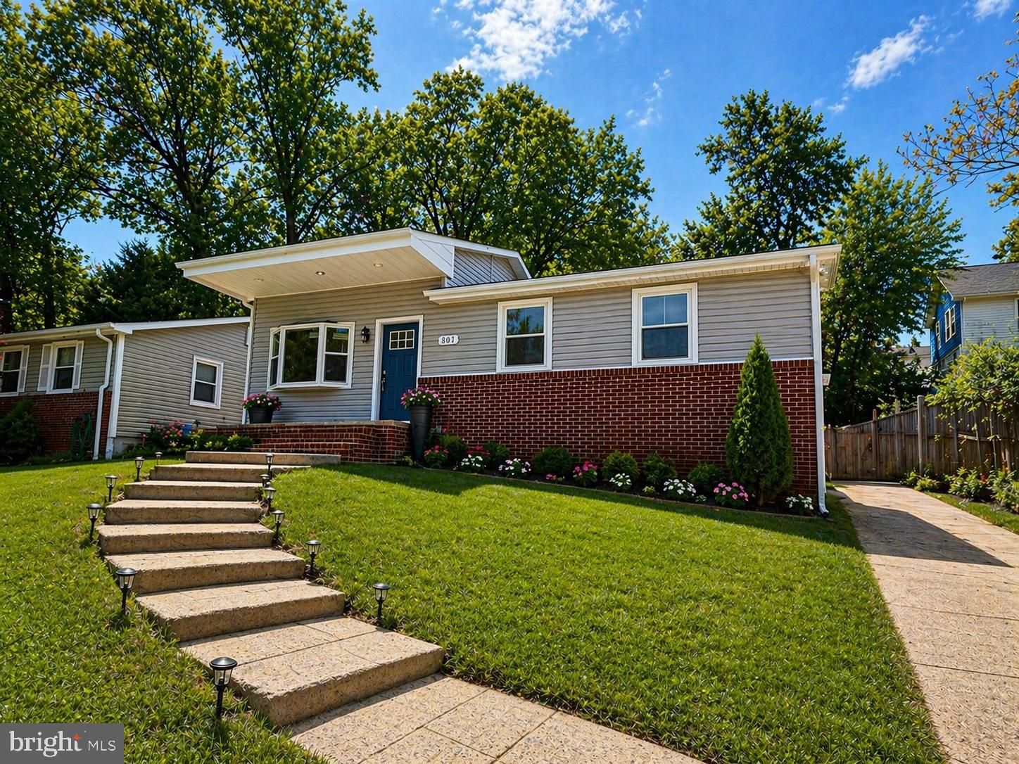 803 Johnson Avenue Silver Spring, MD 20904 - Photo 2 of 3 a front view of a house with a garden