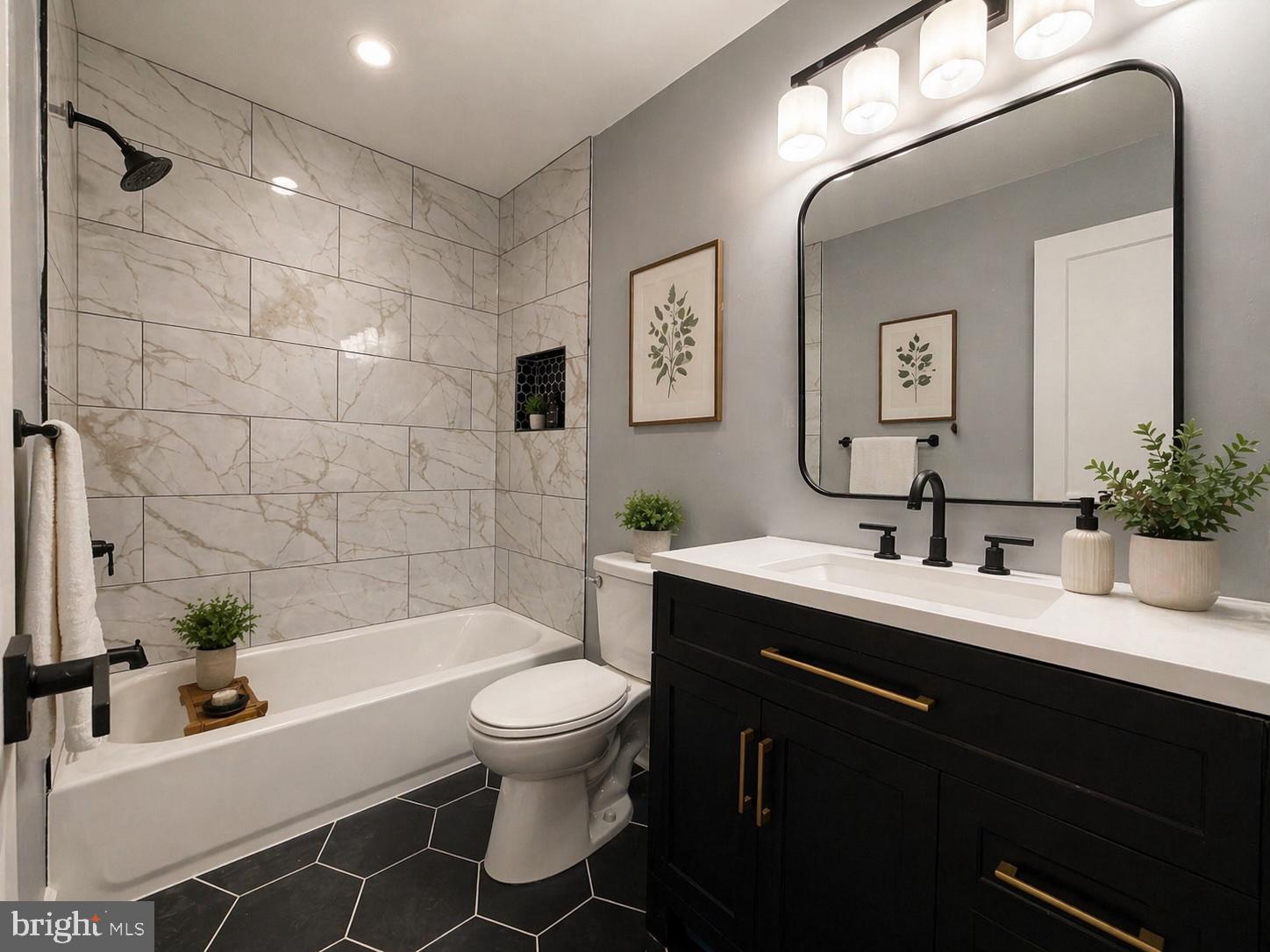 803 Johnson Avenue Silver Spring, MD 20904 - Photo 3 of 3 a bathroom with a sink toilet a mirror and shower