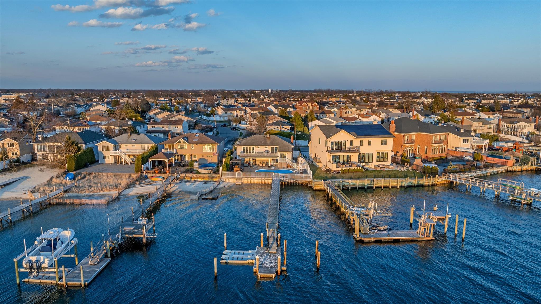 3046 Shore Road Bellmore, NY 11710 - Photo 1 of 1 View of dock featuring a residential view and a water view
