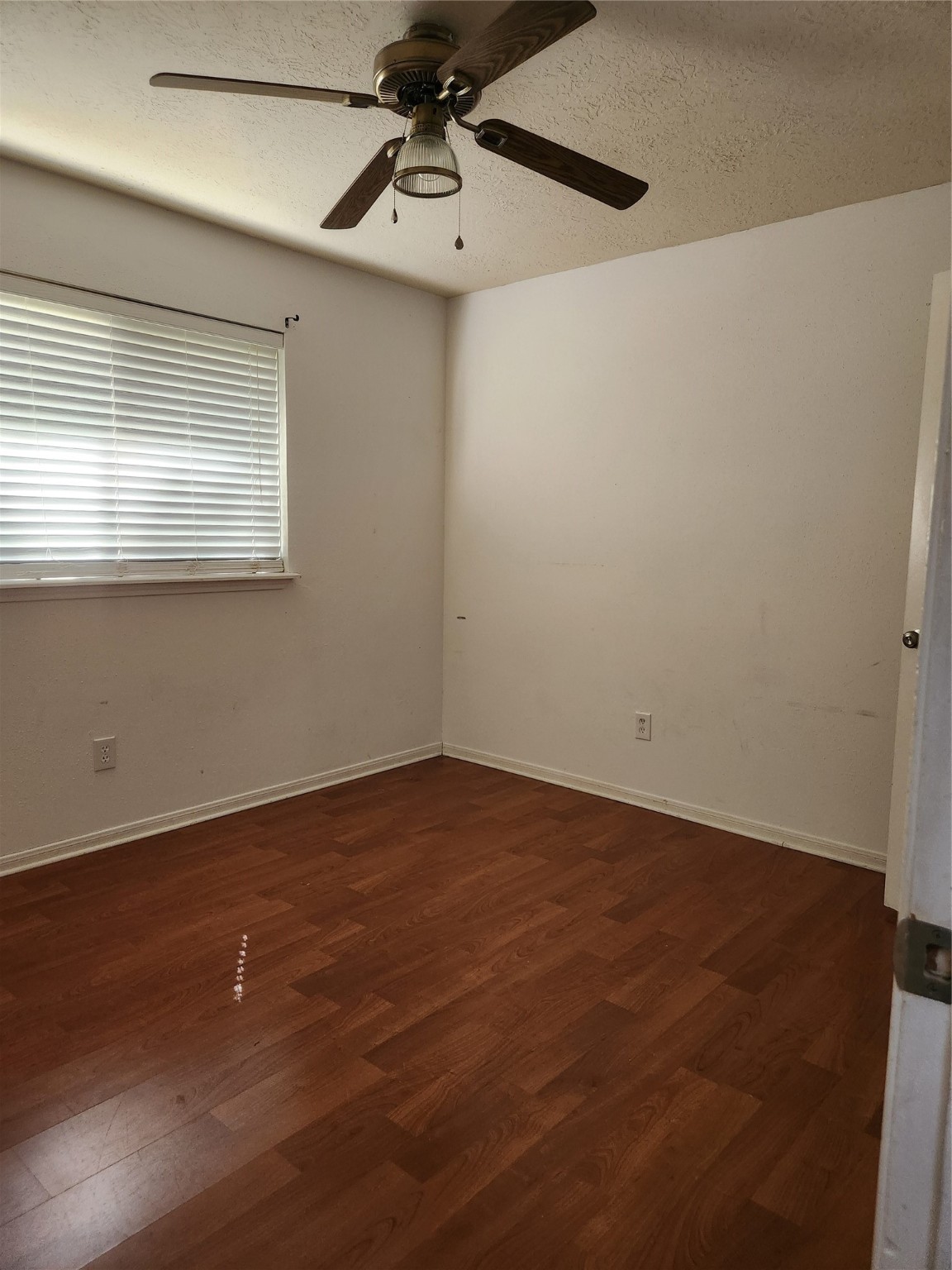 3906 Adonis Drive Spring, TX 77373 - Photo 3 of 9 a view of an empty room with wooden floor and a window