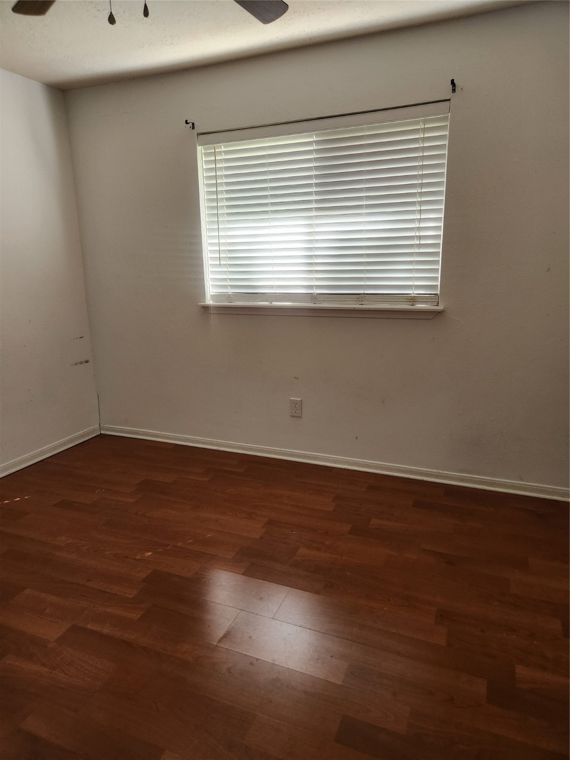3906 Adonis Drive Spring, TX 77373 - Photo 7 of 9 a view of an empty room with wooden floor and a window