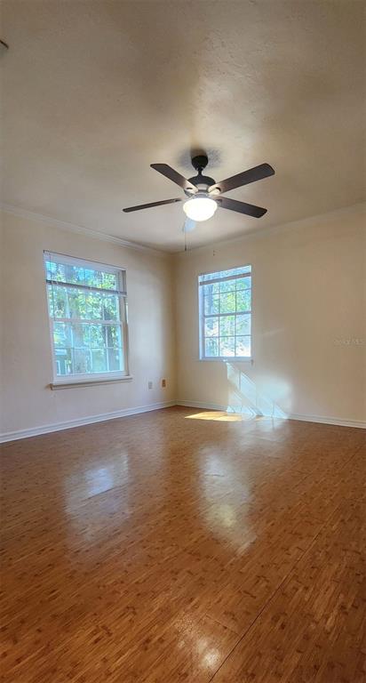 413 Northwest 48th Boulevard Gainesville, FL 32607 - Photo 11 of 21 an empty room with a window and a ceiling fan
