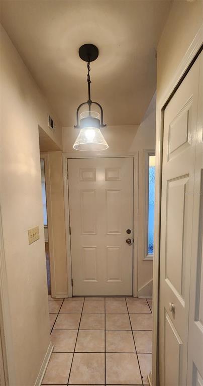 413 Northwest 48th Boulevard Gainesville, FL 32607 - Photo 2 of 21 a view of a hallway to rooms