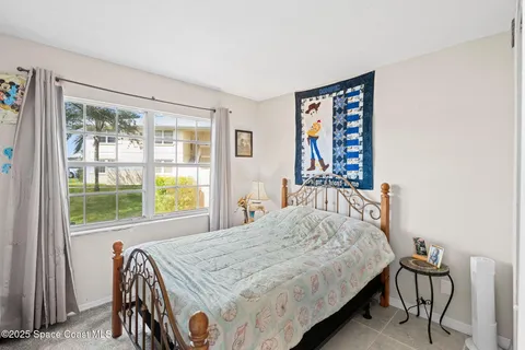a bathroom with a sink vanity mirror and toilet