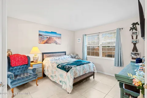 a bedroom with furniture and a bed