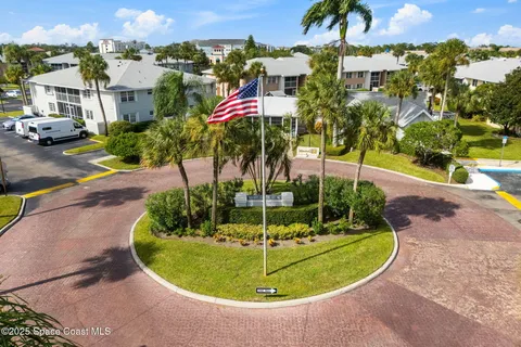 a view of a swimming pool with a yard