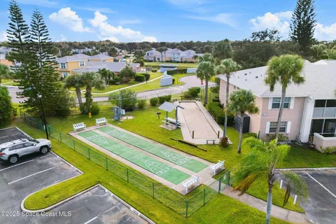 an aerial view of residential building and ocean