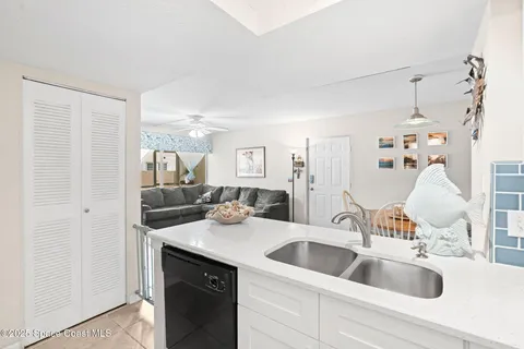 a view of kitchen with cabinets and wooden floor