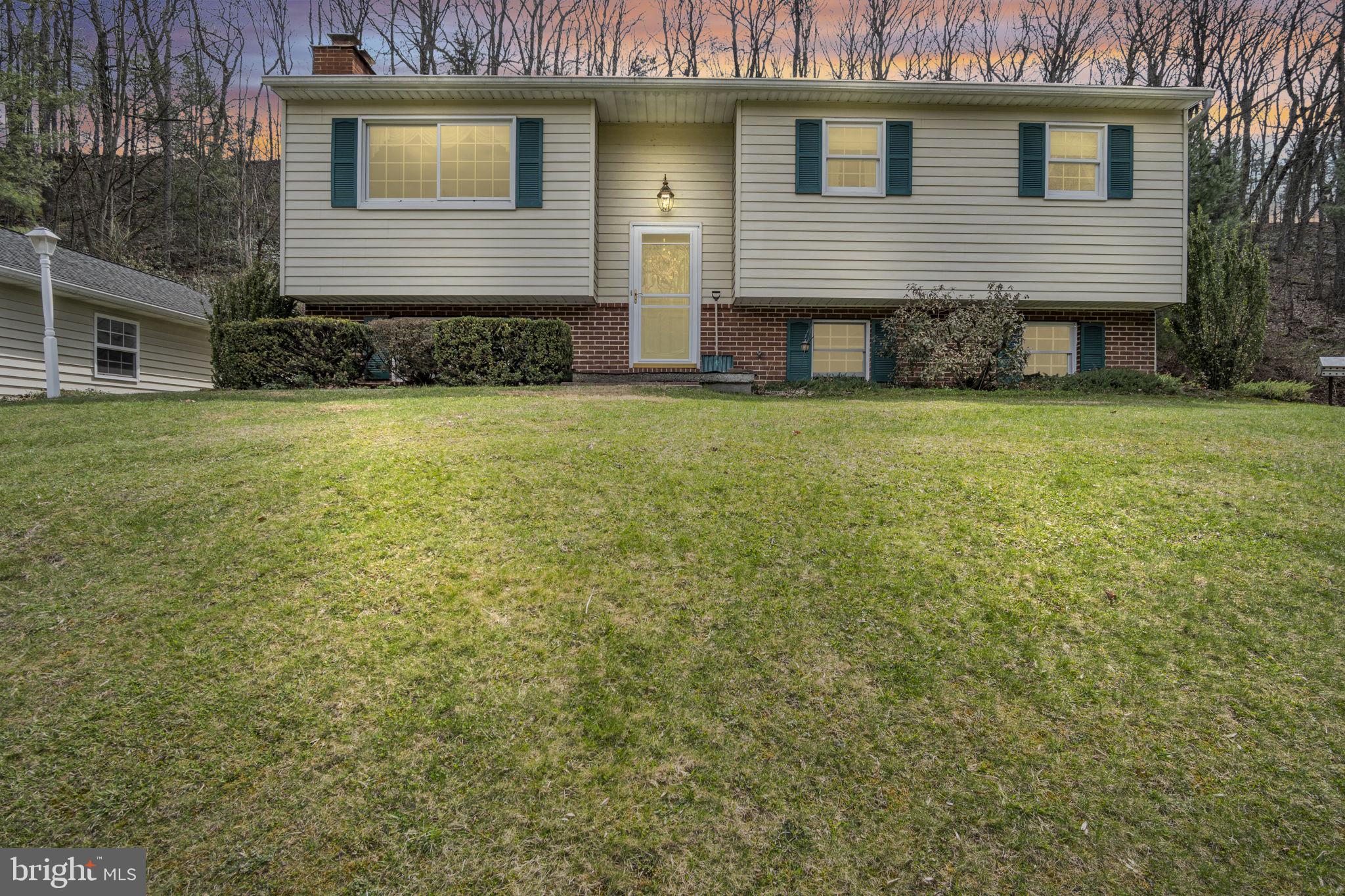 155 Greenbriar Road Elliottsburg, PA 17024 - Photo 2 of 38 Charming split-level home at dusk.