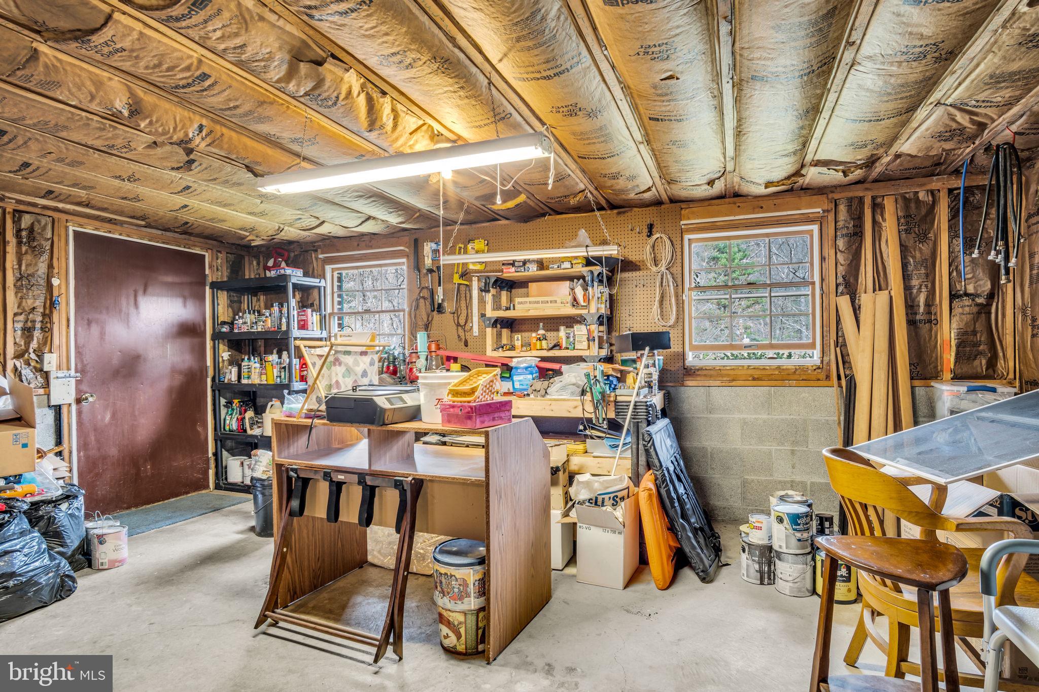 155 Greenbriar Road Elliottsburg, PA 17024 - Photo 25 of 38 Spacious garage with organized tools.