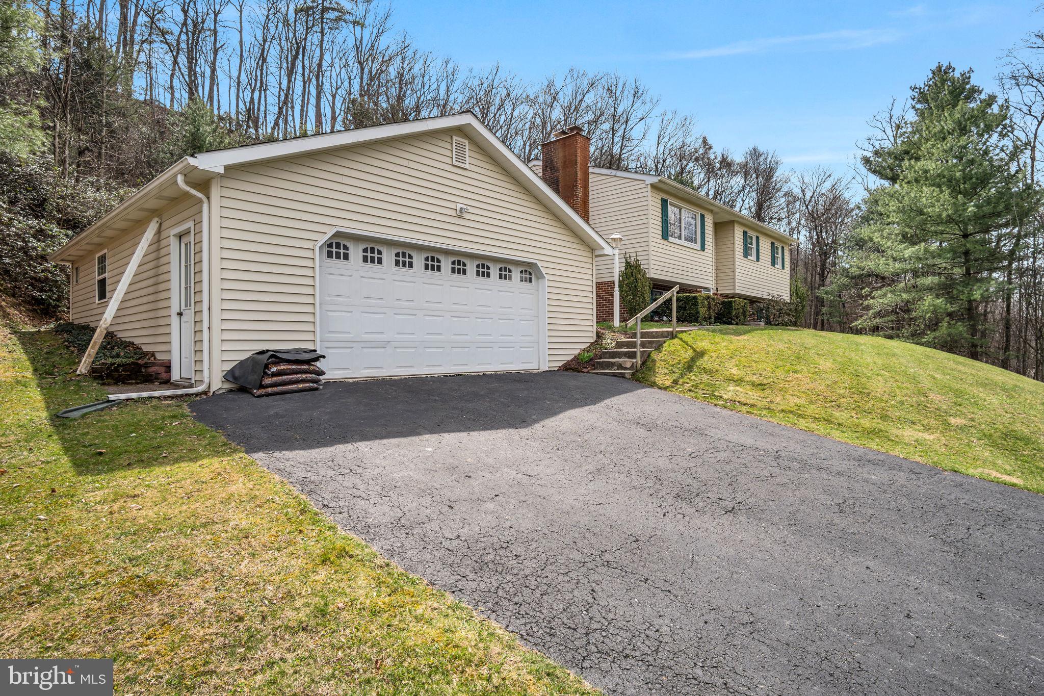 155 Greenbriar Road Elliottsburg, PA 17024 - Photo 5 of 38 Charming hillside home with lush greenery.