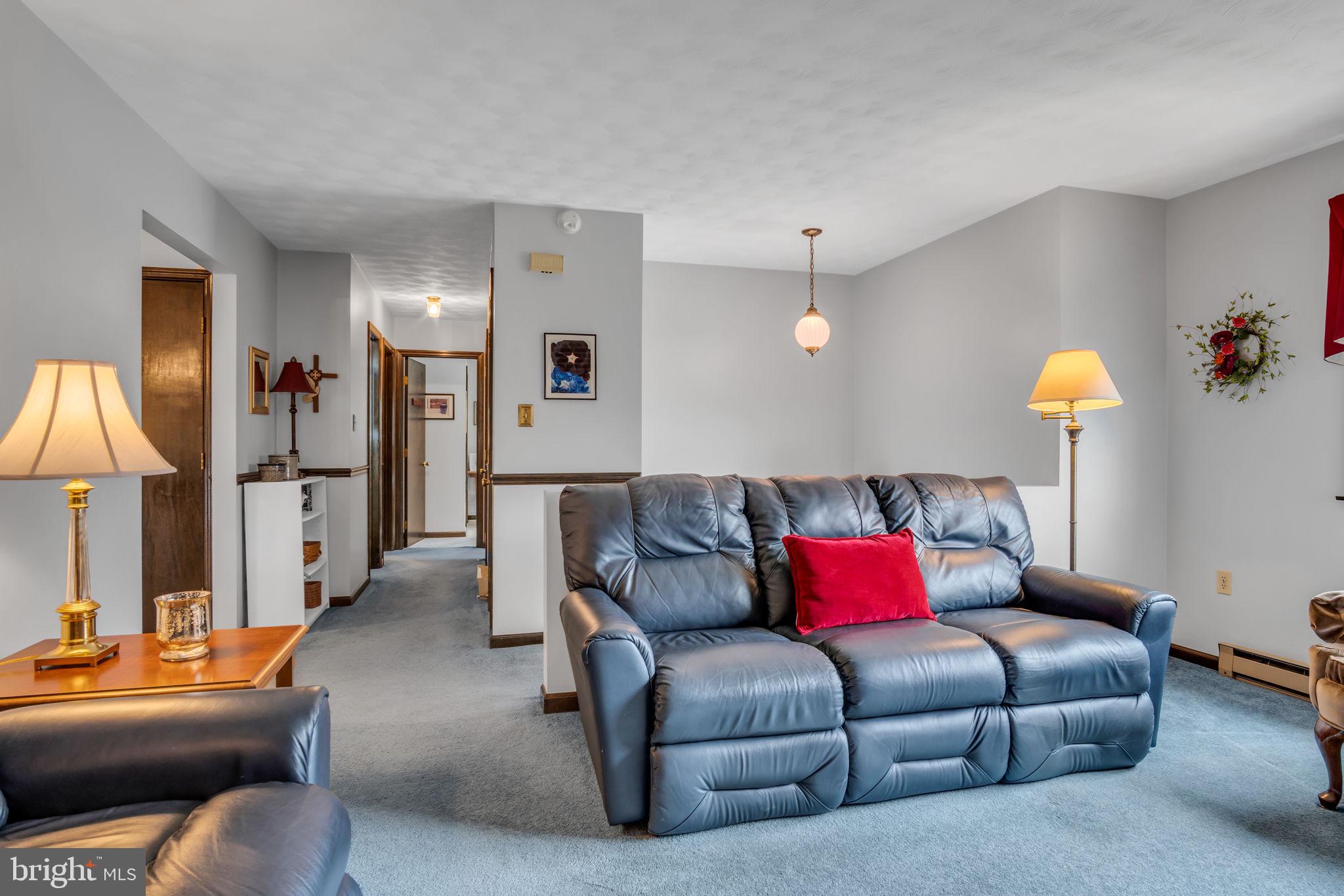 155 Greenbriar Road Elliottsburg, PA 17024 - Photo 8 of 38 Cozy living space with warm lighting.