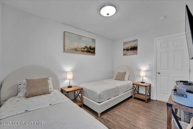 a bathroom with a toilet a sink and shower