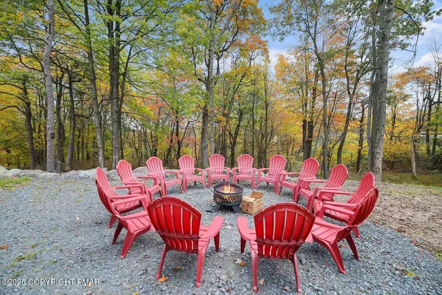 a bedroom with furniture and a large window