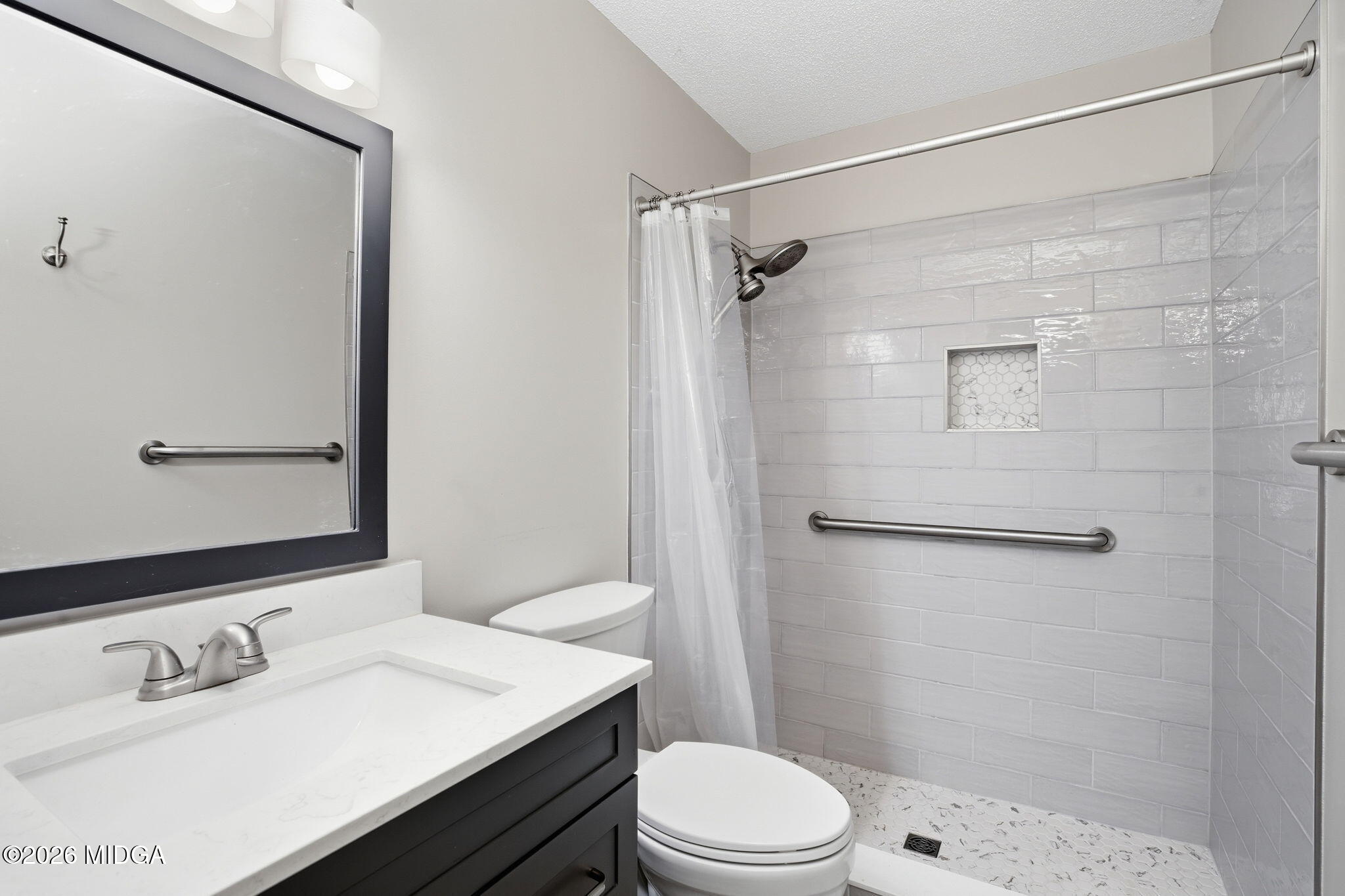 108 Manor Terrace Macon, GA 31210 - Photo 17 of 23 a bathroom with a sink a toilet and shower