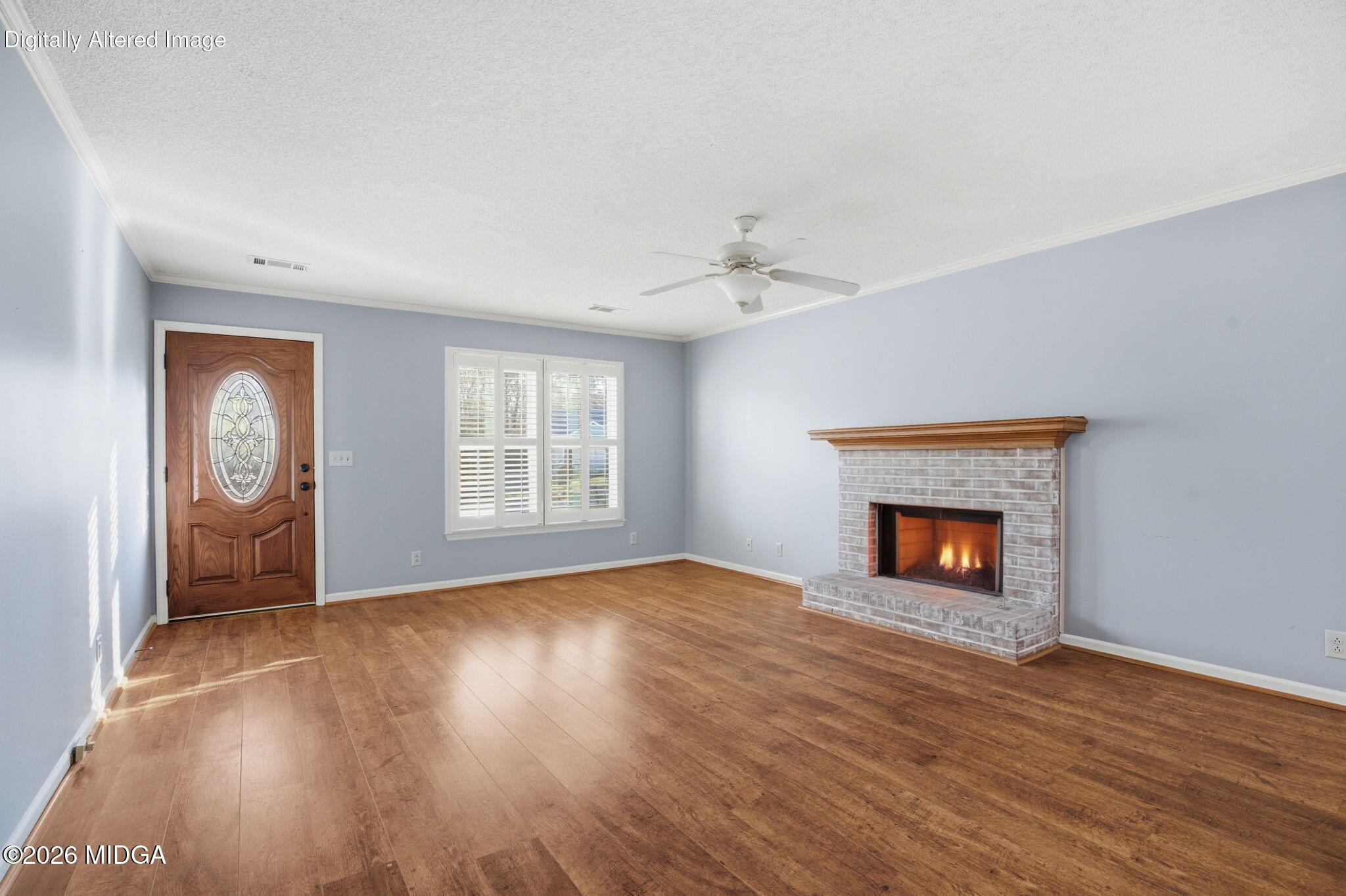 108 Manor Terrace Macon, GA 31210 - Photo 2 of 23 an empty room with windows fireplace and wooden floor