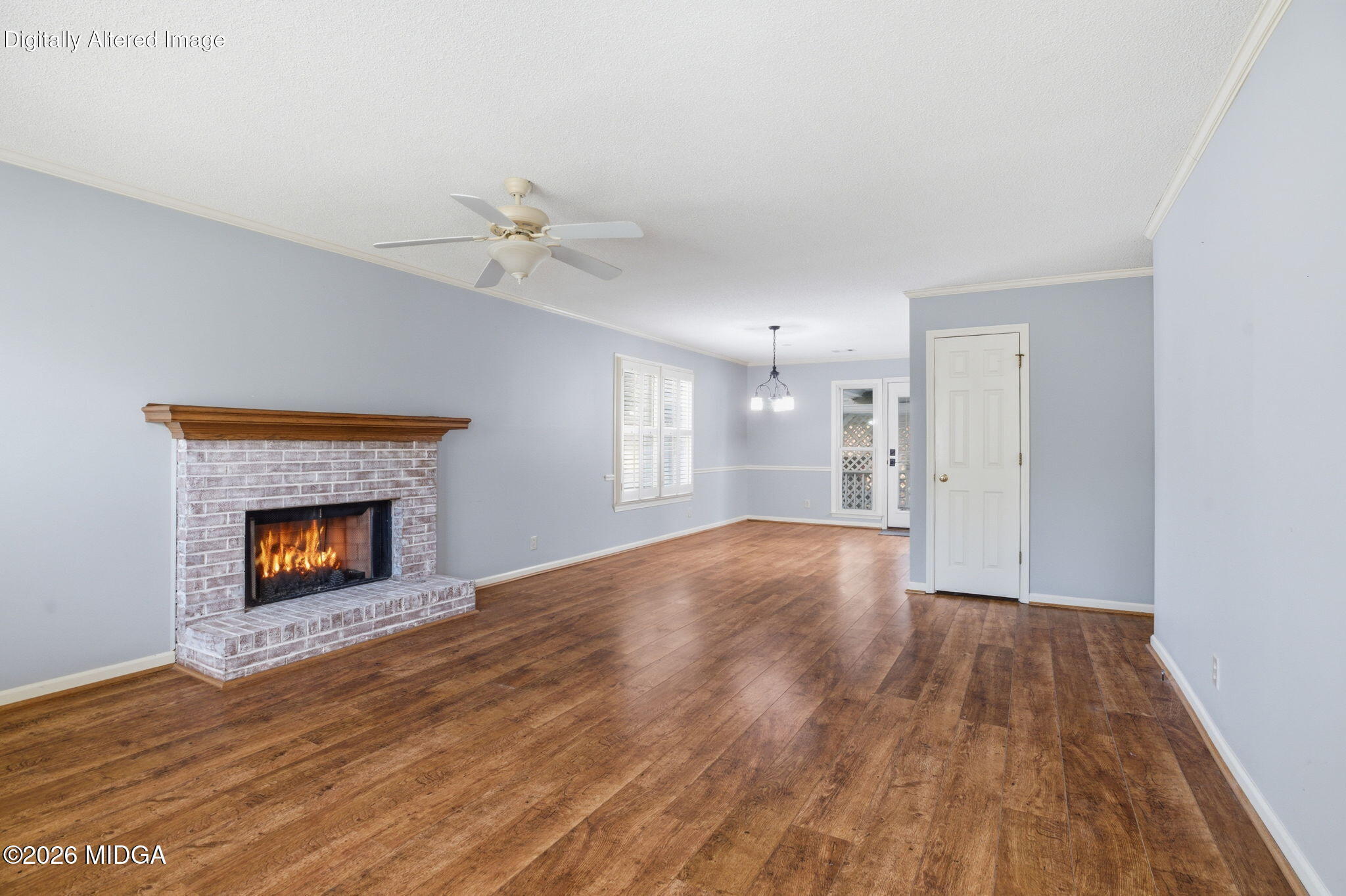108 Manor Terrace Macon, GA 31210 - Photo 3 of 23 a view of an empty room with wooden floor fireplace and a window