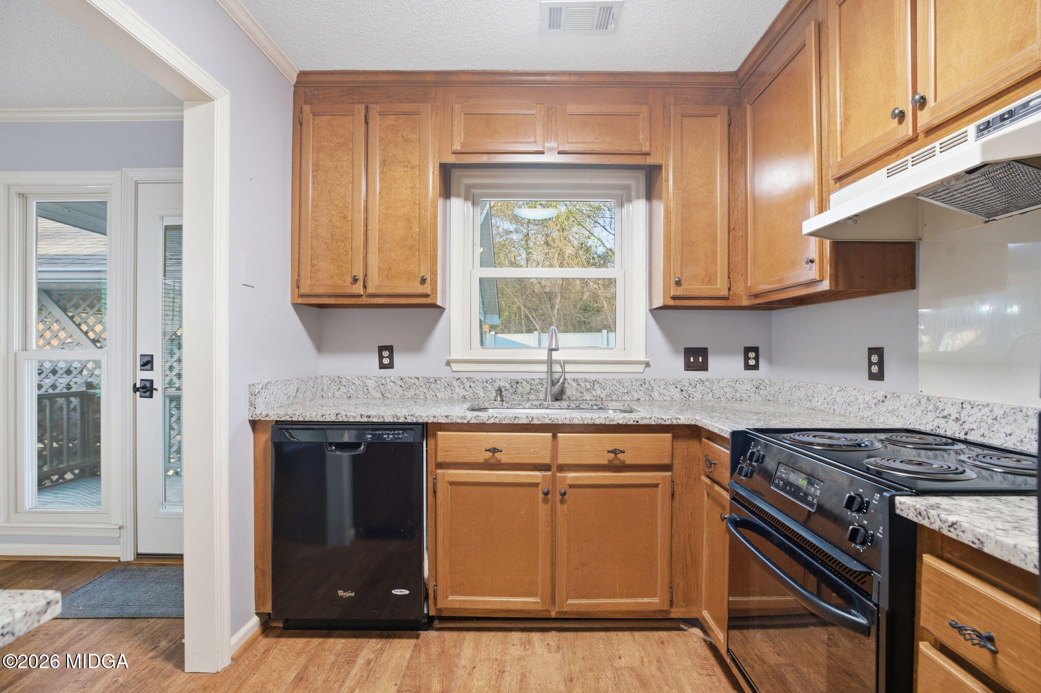 108 Manor Terrace Macon, GA 31210 - Photo 7 of 23 a kitchen with granite countertop a sink stove and cabinets