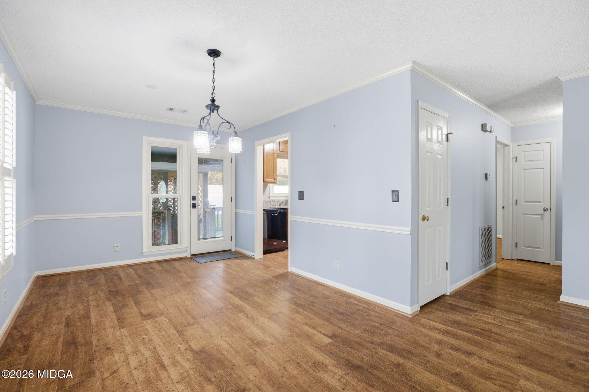 108 Manor Terrace Macon, GA 31210 - Photo 10 of 23 a view of a hallway with wooden floor and a chandelier