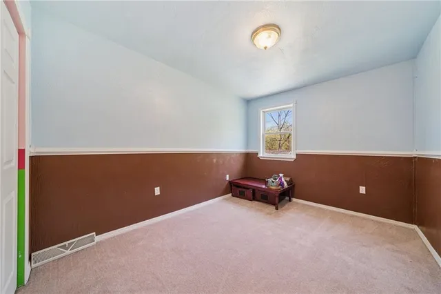 a view of room with gym equipment