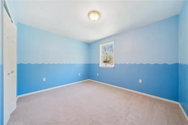 a view of an empty room and closet