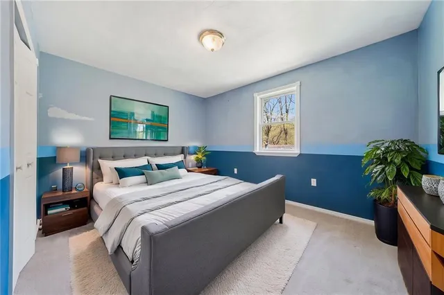 a view of a house with wooden deck and a yard
