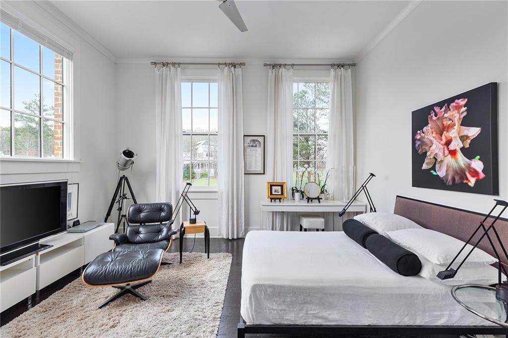 10625 Serenbe Lane, Unit 204 Chattahoochee Hills, GA 30268 - Photo 12 of 20 a living room with furniture a flat screen tv and a window