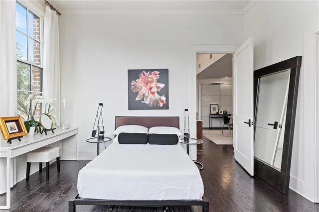 a bedroom with a bed and a table with chair