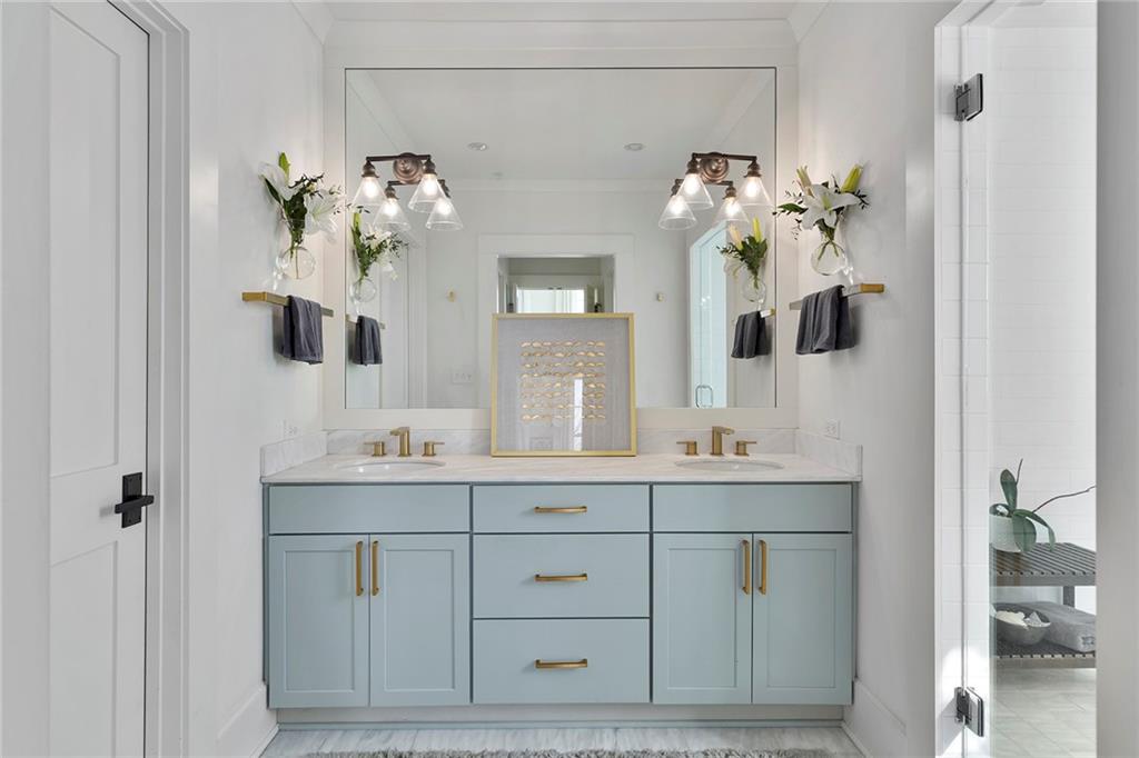 10625 Serenbe Lane, Unit 204 Chattahoochee Hills, GA 30268 - Photo 15 of 20 a bathroom with a double vanity sink and mirror